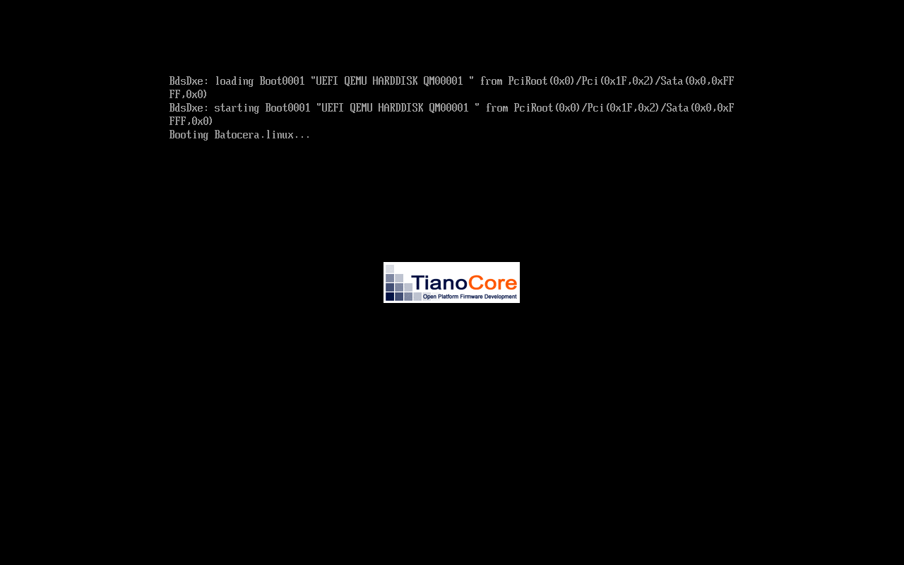Layar firmware UEFI TianoCore hitam dengan teks BdsDxe loading Boot0001 UEFI QEMU HARDDISK dan baris Booting Batocera.linux