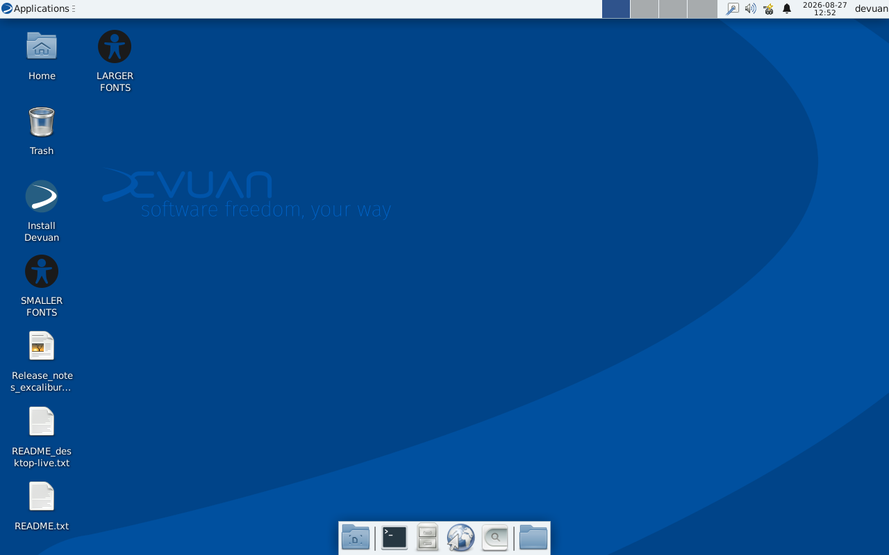 Desktop Devuan Excalibur lengkap dengan wallpaper biru bertuliskan software freedom your way, ikon Home, Trash, Install Devuan, Release notes, dan README di kiri layar