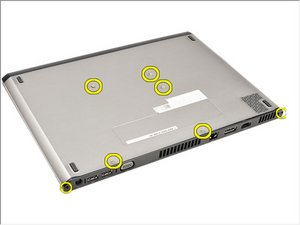 Langkah 1 — Lepaskan Kancing Bawah Laptop