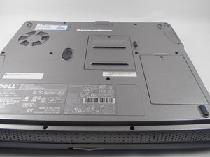 Langkah 1 — Membuka Panel RAM dan Mengakses CD Drive