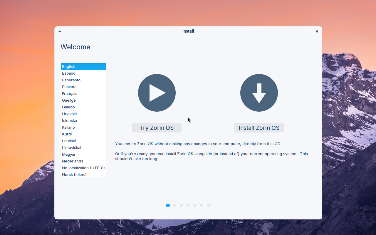 Layar Welcome pemasang Zorin OS dengan daftar pilihan bahasa di kiri dan dua tombol besar Try Zorin OS serta Install Zorin OS