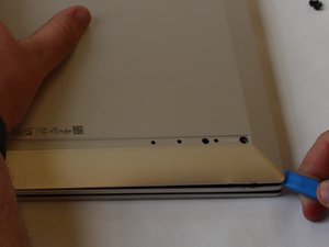 Langkah 3 — Buka Tutup Belakang dengan Tool iFixit