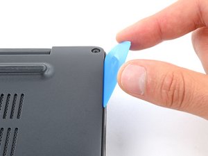Langkah 3 — Gunakan Spudger untuk Melepaskan Klik Plastik