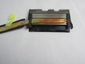 Langkah 6 — Melepas Tape Penjepit Heat Sink