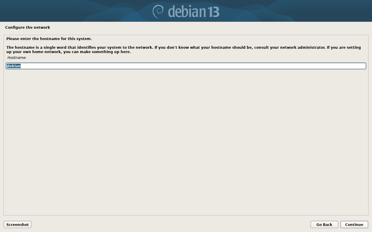 Layar Configure the network Debian meminta hostname dengan isian debian