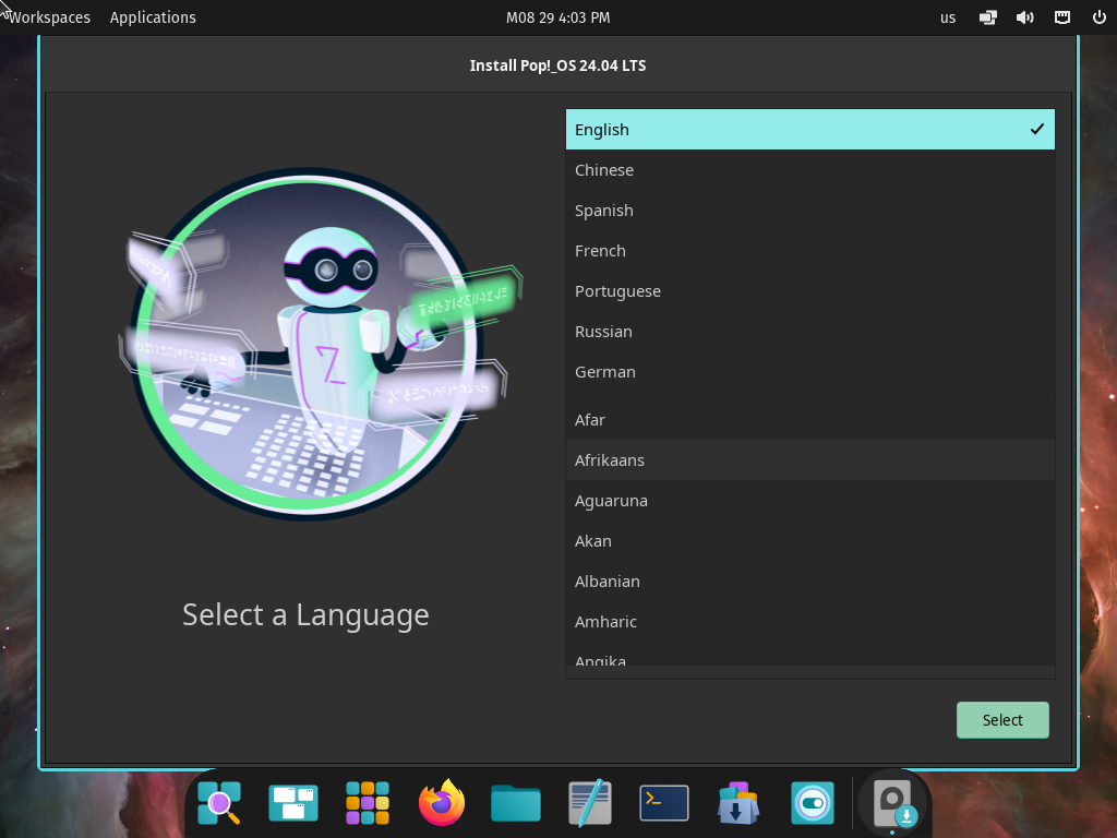 Jendela Install Pop!_OS 24.04 LTS berisi Select a Language dengan English tercentang di daftar bahasa dan tombol Select, di belakangnya panel atas Workspaces Applications dan dock ikon aplikasi di bawah