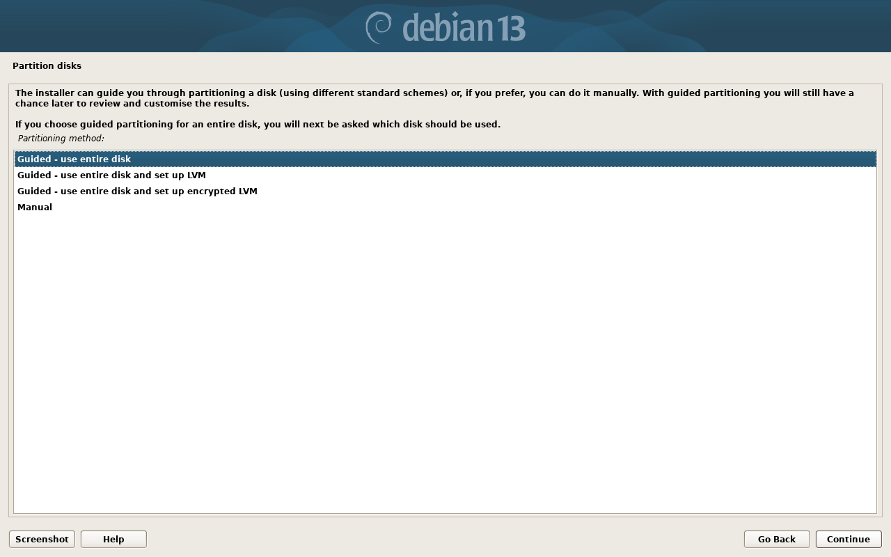 Layar Partition disks Debian dengan empat metode partisi
