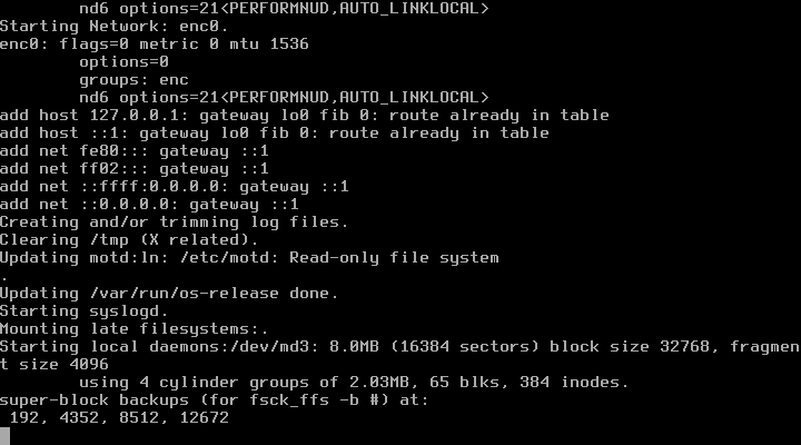 Log startup FreeBSD menampilkan konfigurasi jaringan enc0, penambahan rute gateway, dan proses memulai syslogd sebelum installer grafis tampil