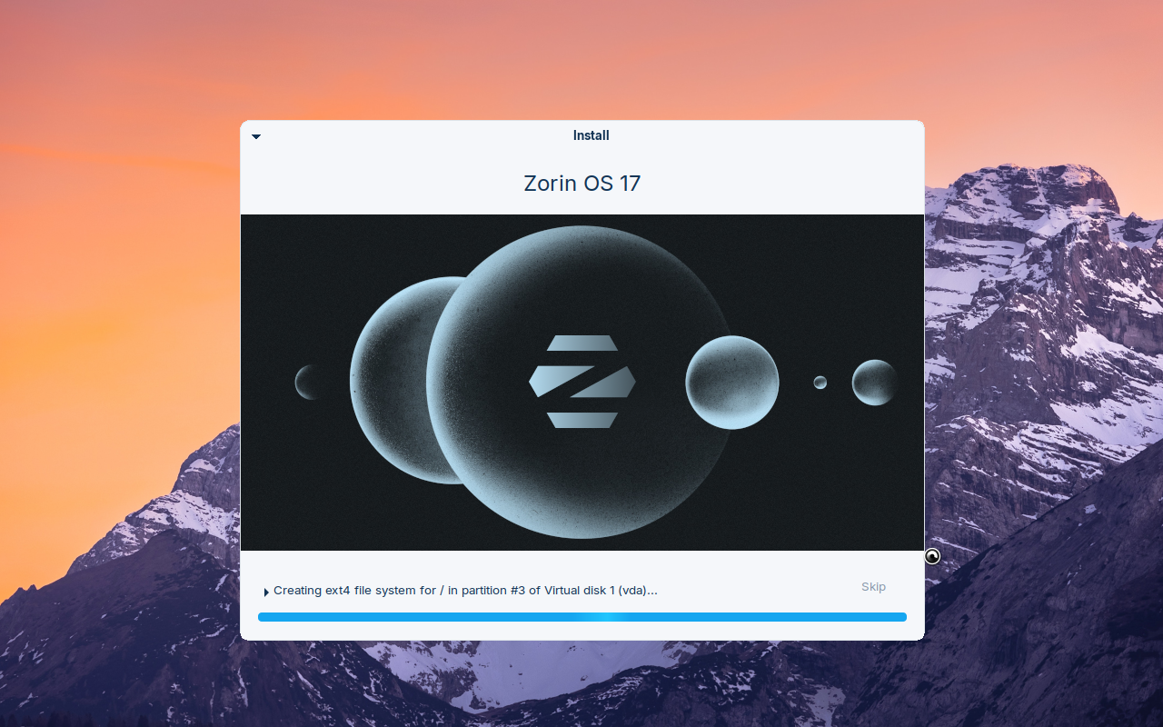 Layar proses instalasi Zorin OS 17 dengan animasi logo planet berwarna abu-abu kebiruan dan bilah progres di bawah, status Creating ext4 file system