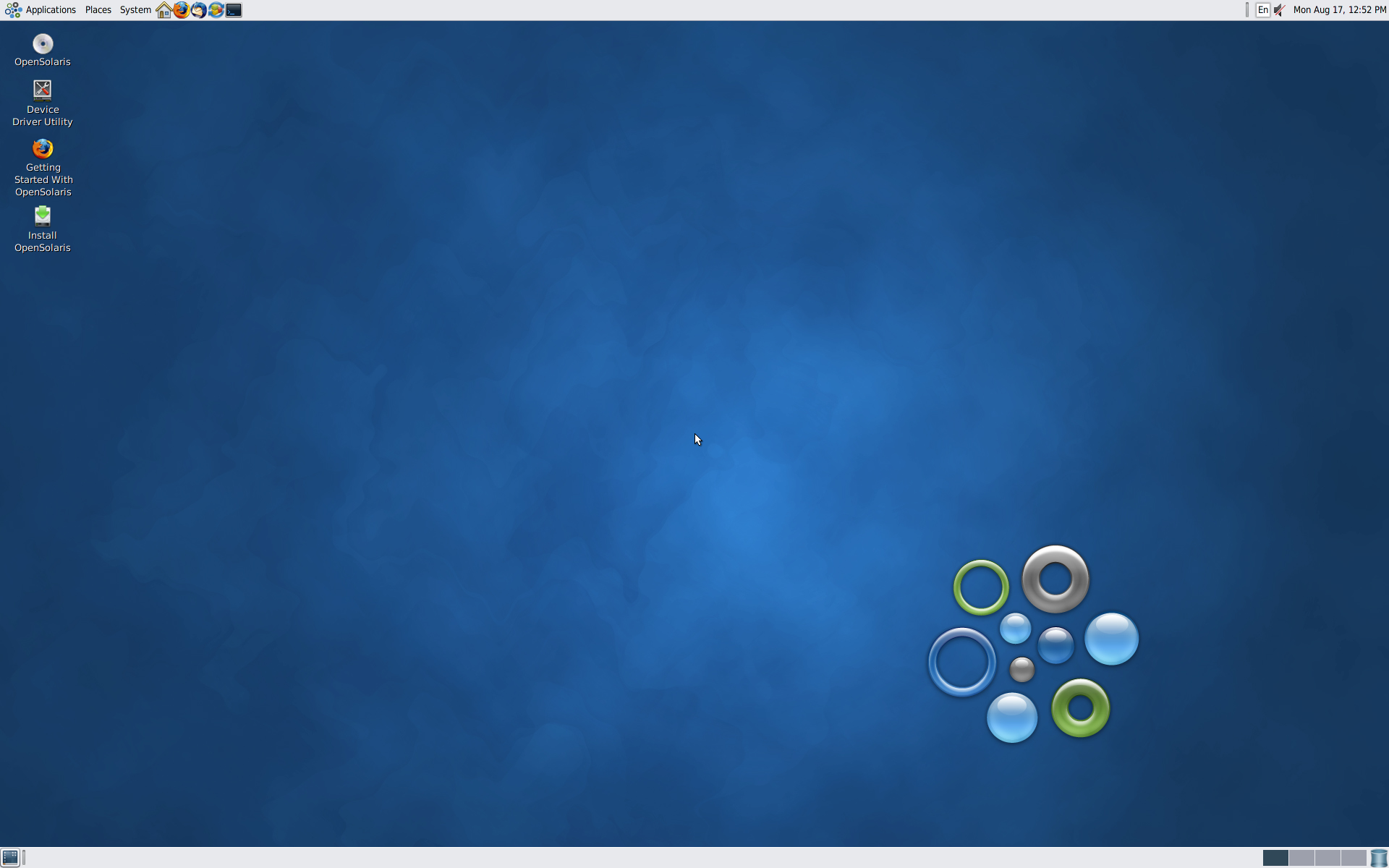 Desktop OpenSolaris 2009.06 dengan ikon Device Driver Utility, Getting Started With OpenSolaris, dan Install OpenSolaris