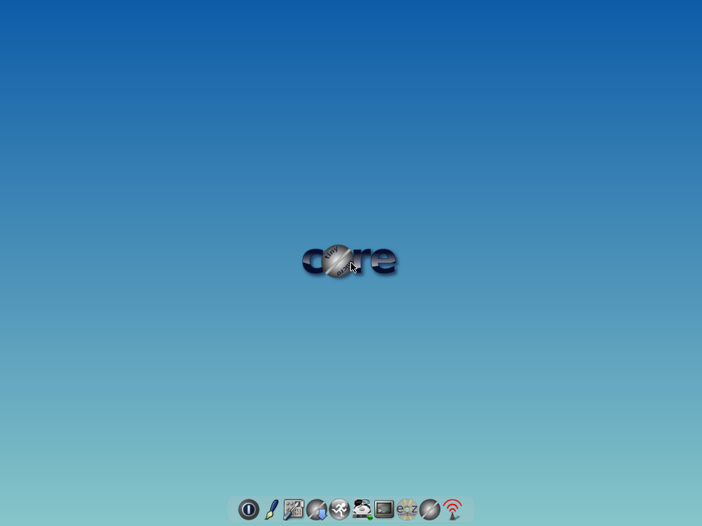 Desktop Tiny Core CorePlus dengan logo core di tengah dan dok aplikasi di bagian bawah layar